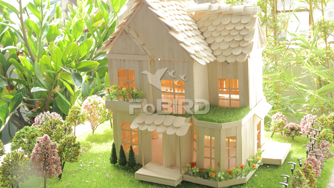 simple miniature house made of popsicle sticks