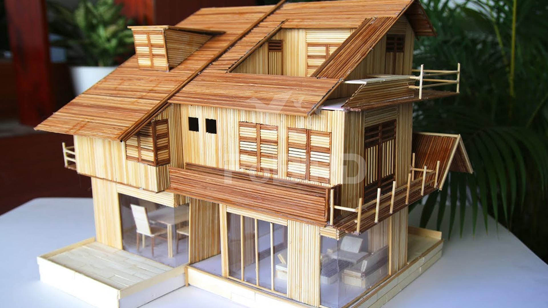 simple miniature house made of popsicle sticks